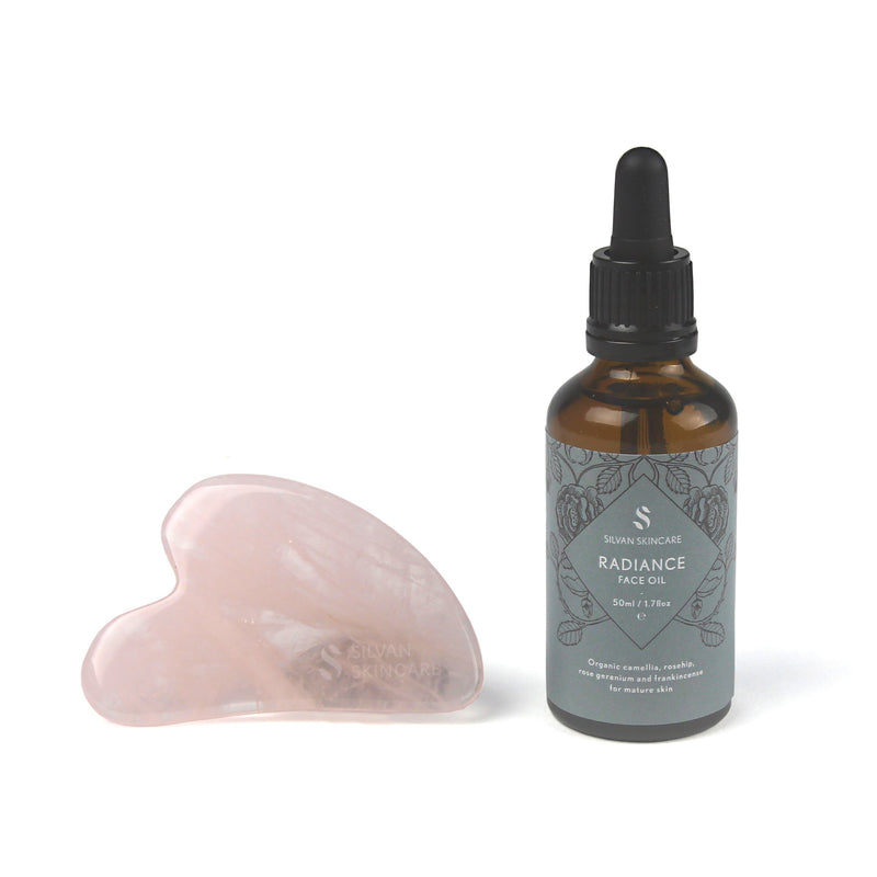 Radiance Gua Sha Facial Set with face oil and rose quartz gua sha stone.